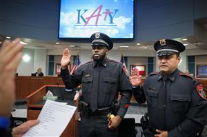Officer Kenon and Officer Flores being Sworn In at the School Board Meeting on July 24th, 2022.